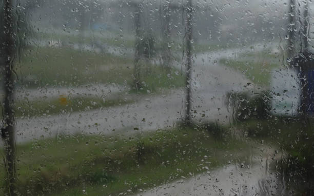 istock ainwater drops on glass - street rain 1433448189