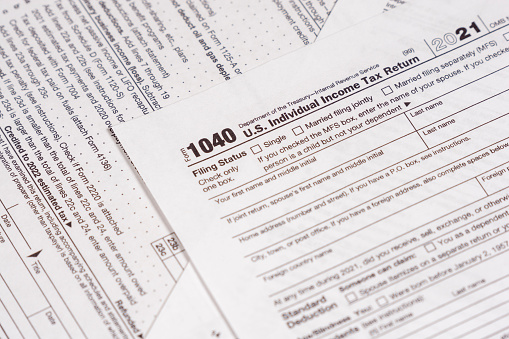 Shot of various IRS tax forms, 1040, 1120-S for sending in personal and corporate tax returns.
