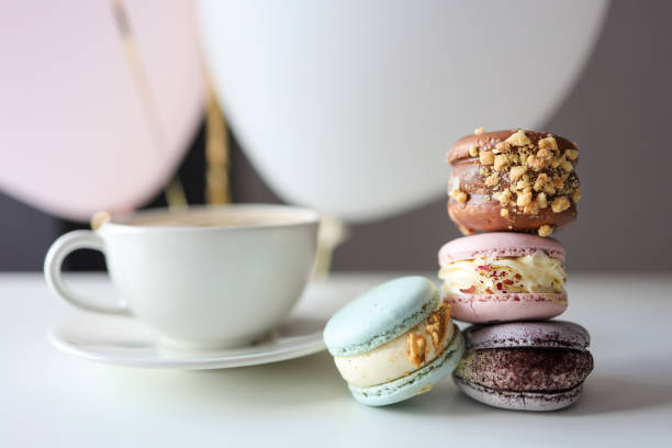 Morning coffee with macaroons in a cafe, good morning birthday stock photo