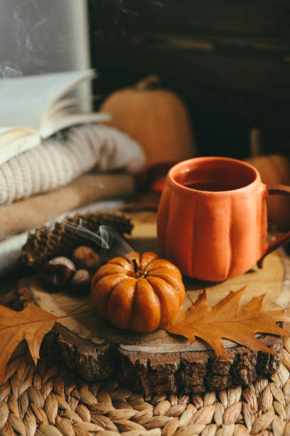 istock Smoke from an extinguished candle and a cup of tea, autumn composition 1433450458