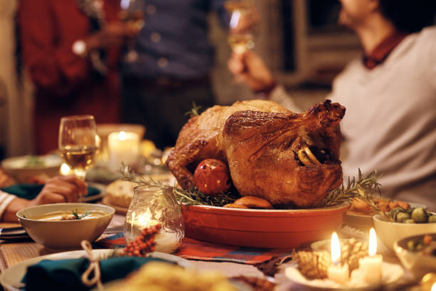 istock Close up of stuffed turkey during Thanksgiving dinner at dining table. 1433453947