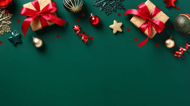 istock Christmas frame top border. Christmas decorations, gift boxes, Xmas baubles on dark green background. Flat lay. Top view. 1433455986