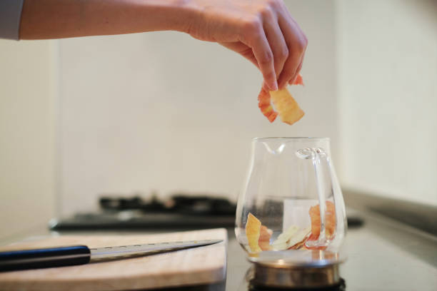 istock Closeup of woman's hands making apple tea 1433469218