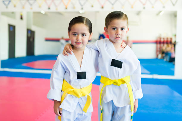 istock Beautiful kids looking happy while learning martial arts 1433469959