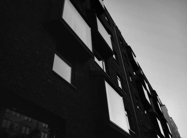 istock Low angle view modern building against sky in black and white 1433472251