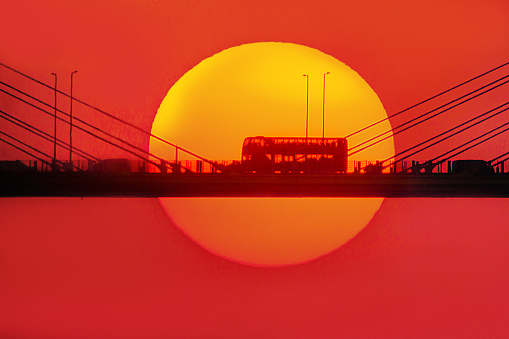 The sunset bus at Ting Kau Bridge happens to be at the center of the sun