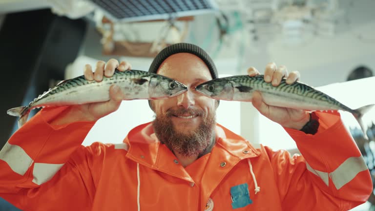 Fisherman with fish in front of his eyes