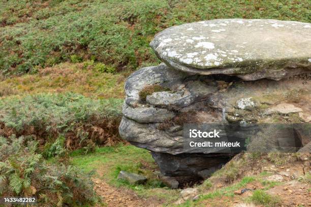 Sandstone Weathered Rock Outcrop In Yorkshire England Uk Looking Like An Old Man Wearing A Flat Cap Hat Stock Photo - Download Image Now
