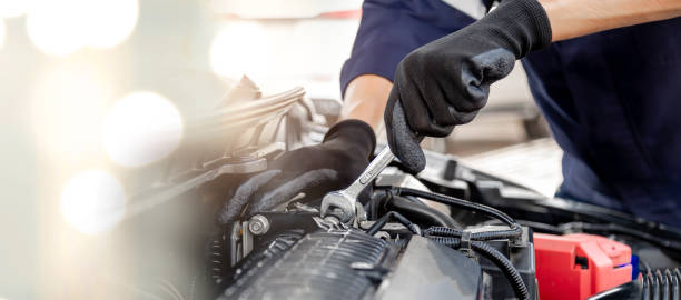 istock Car care maintenance and servicing, Close-up hand technician auto mechanic using the wrench to repairing change spare part car engine problem and insurance service support. 1433489798