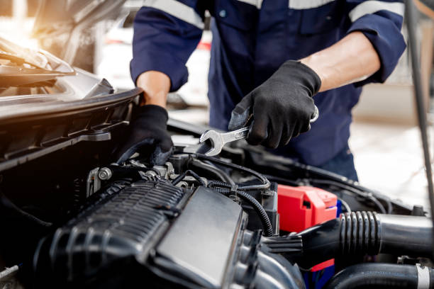 istock Car care maintenance and servicing, Close-up hand technician auto mechanic using the wrench to repairing change spare part car engine problem and insurance service support. 1433490254