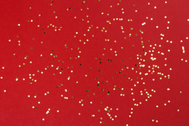 istock Festive background with star shaped confetti. 1433494317