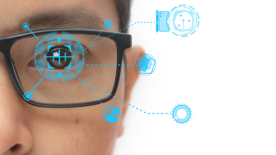 Man wearing eyeglasses with virtual screen future technology, biometric of a scientist with futuristic graphics and holography with which scans, immersive technology, metaverse universe.
