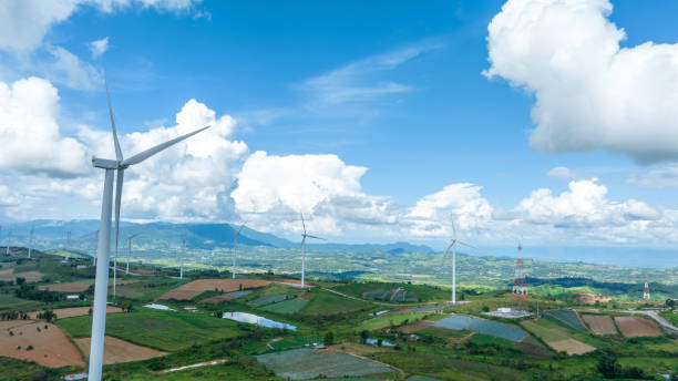 istock Wind Turbines Windmill Energy Farm, Windmill on blue sky puffy cloudsAlternative energy sources. Renewable electric sustainable nature energy technology. 1433500859