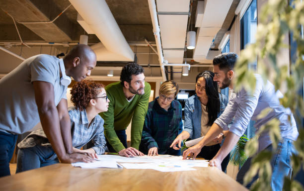 Group of creative workers talking in a business meeting