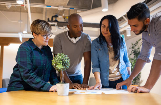 istock Group of workers in a meeting designing a business plan 1433501561