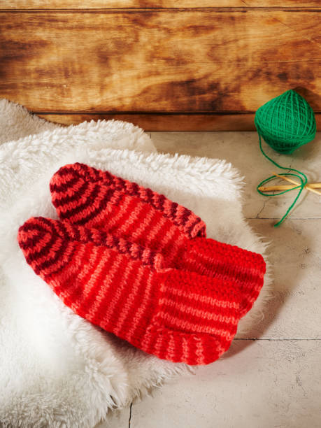 istock knitted socks on a white fur background 1433507417