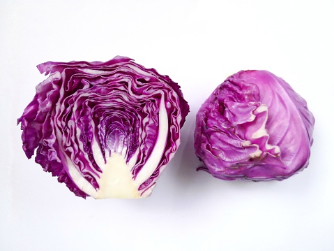 purple cabbage cut in half isolated on a white background