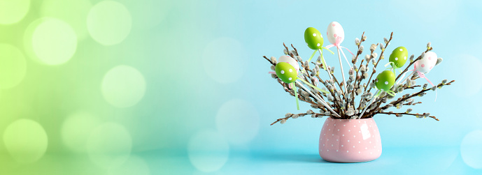 Easter eggs dyed with onion peels with a pattern of herbs in a basket, close up