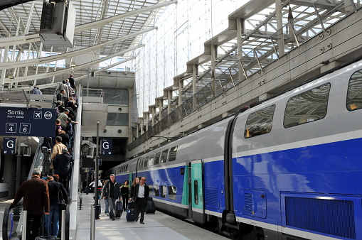 Glasgow, Scotland - July 14, 2022:  Passengers in a hurry to catch the train at  Glasgow Central station.