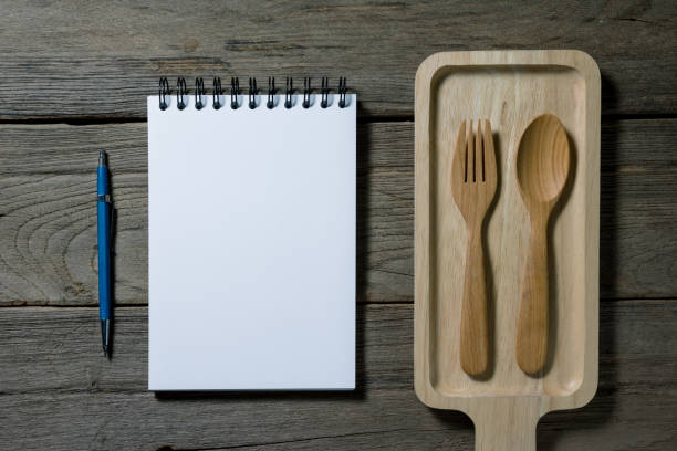 istock open note book with wooden tray on desk 1433524013