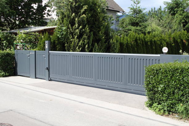istock a driveway with a gray sliding gate 1433524688