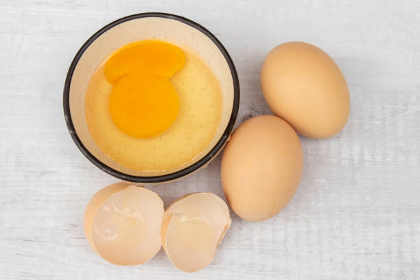 istock Eggs isolated on white background, broken chicken eggs with yolk. Close up view 1433526219