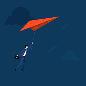 istock Businessman flying on the paper plane 1433527365