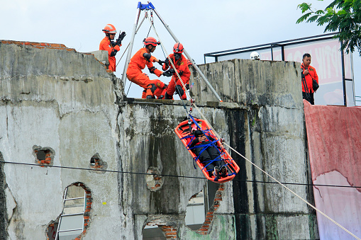 Yogyakarta, Indonesia, July 26, 2016. Action of the National Search and Rescue Agency (Basarnas) in simulation of evacuation earthquake victims.
