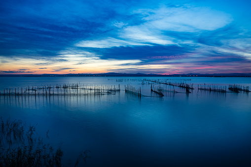 Blue colors during sunset over Albufera lake. Valencia-Spain. High resolution 42Mp outdoors digital capture taken with SONY A7rII and Zeiss Batis 25mm F2.0 lens