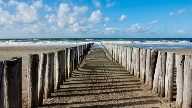 istock Wave breaker at the north sea beach 1433539925