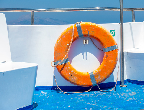 Life buoy on railing in passenger ship