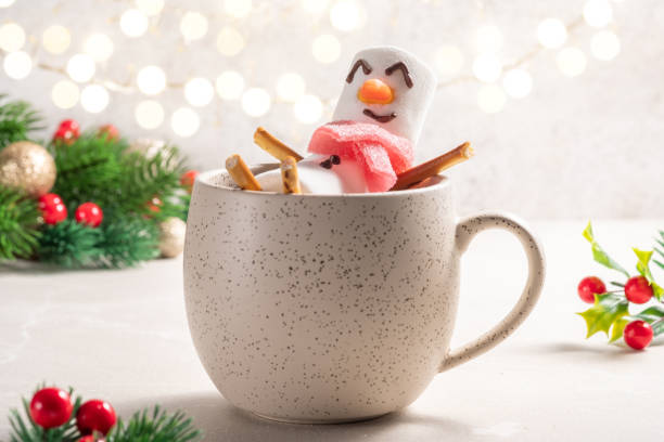 istock Mug with hot chocolate with melted marshmallow snowman 1433541286