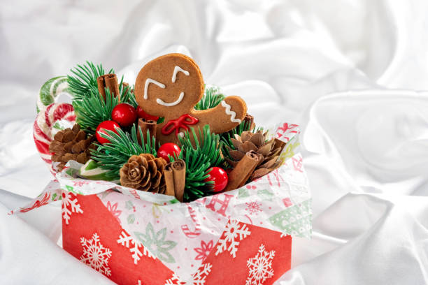 Christmas Decorations with Gingerbread man cookie and Gift Box.