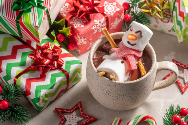 istock Mug with hot chocolate with melted marshmallow snowman 1433541295