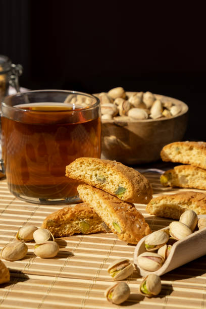 istock Biscotti Cantuccini Cookie Biscuits with pistachios and lemon peel Shortbread. Cup of tea. Teatime break Healthy eating food. Homemade fresh Italian cookies cantucci stacks and organic pistachios nuts. Vegan dieting 1433544003
