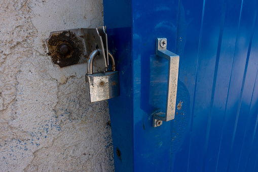 Key lock old stitched in the blue door