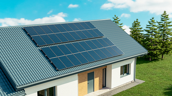 Skipwith, UK - October  20, 2021.  A new build home with built in photovoltaic solar panels in the roof generating clean and renewable energy for domestic use