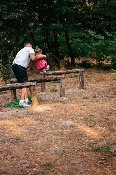 istock Father helping his little daughter overcome obstacles 1433548237