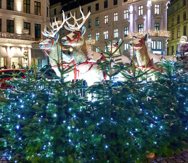 istock Illuminated artificial reindeer and Santa in Copenhagen 1433548823