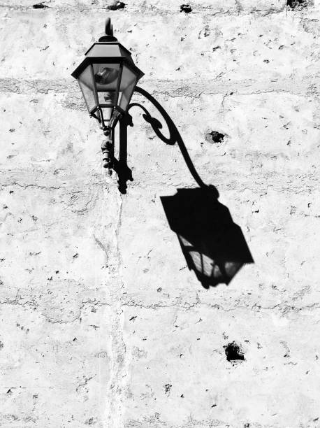 istock Grayscale of a lamp hanging from a wall 1433550559