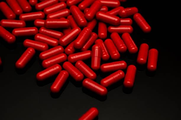 istock Closeup shot of red pillars on a black surface 1433553127