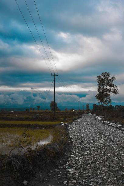 istock Gravel road with a sunset background 1433554653