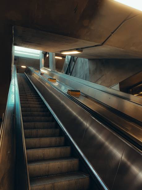 istock Vertical shot of empty escalator in train station at night 1433554990