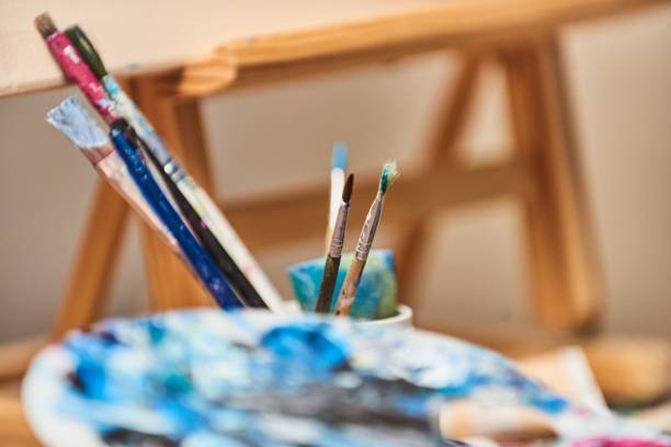 istock Closeup of painting brushes on the table 1433555077