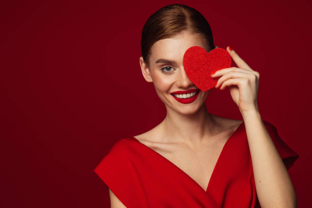 istock Beautiful emotional woman holding present box 1433556475