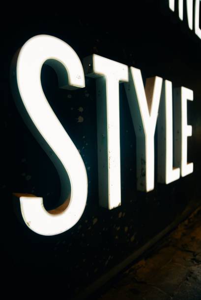 istock Vertical of a neon style writing on a black wall. 1433562521