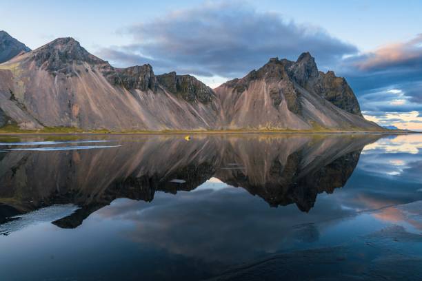 istock Reflection of mountains in the sea 1433562713