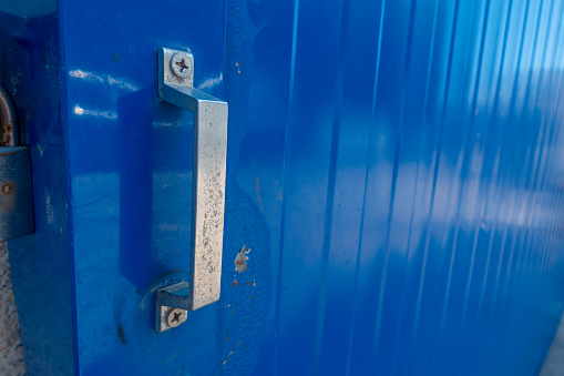 Key lock old stitched in the blue door