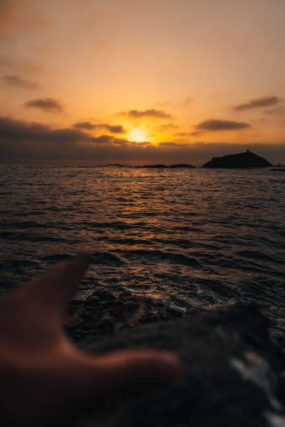 istock Vertical shot of a bright sunset over a beautiful sea 1433565722