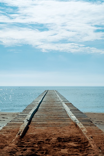 A wooden dock surrounded by water in Jesolo